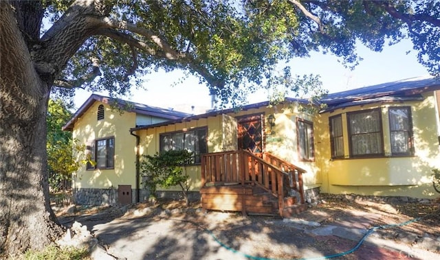 view of front of house featuring stucco siding