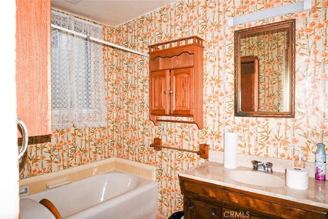 bathroom featuring vanity and a tub to relax in