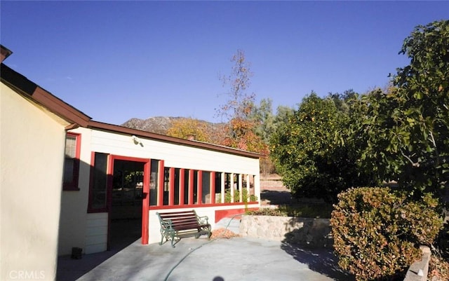 view of patio / terrace with a mountain view