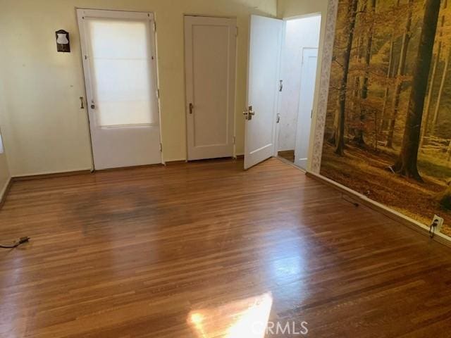 interior space with hardwood / wood-style floors