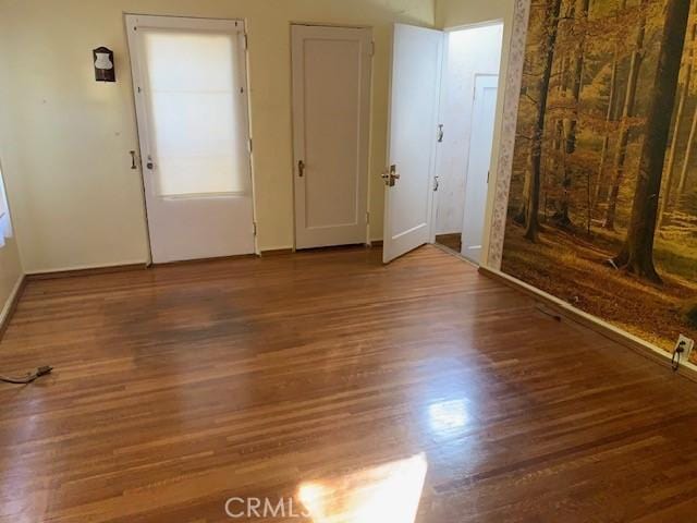 spare room with hardwood / wood-style floors