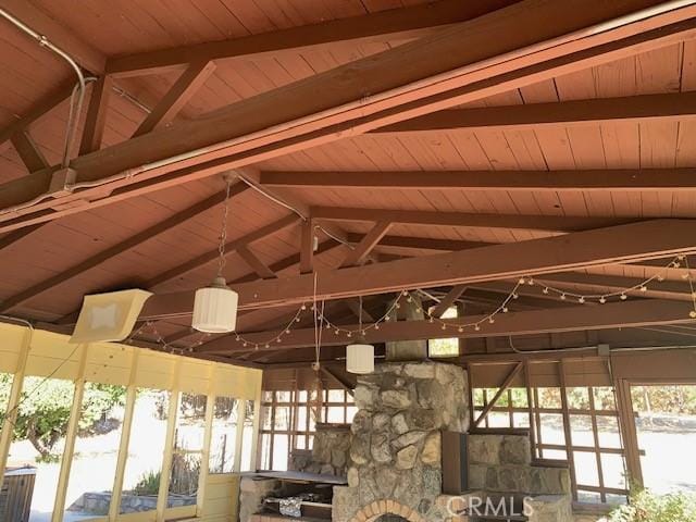 misc room with lofted ceiling with beams and wood ceiling