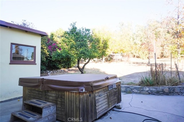 view of patio with a hot tub