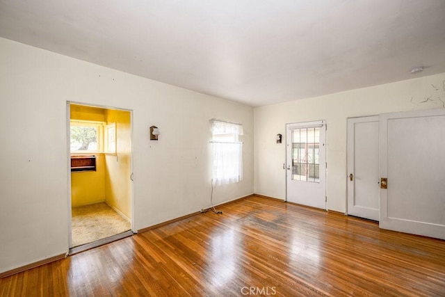 unfurnished room featuring wood finished floors