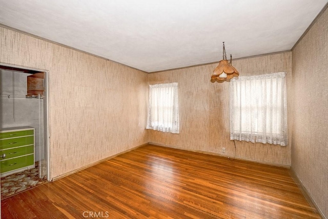 unfurnished room featuring wood finished floors