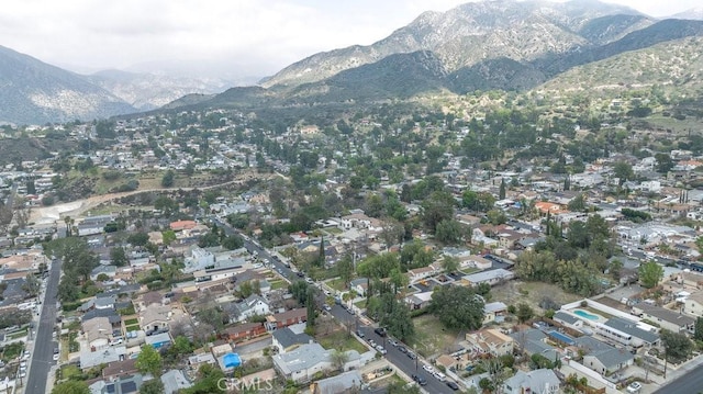 drone / aerial view featuring a mountain view and a residential view