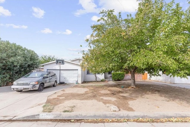 obstructed view of property with a garage