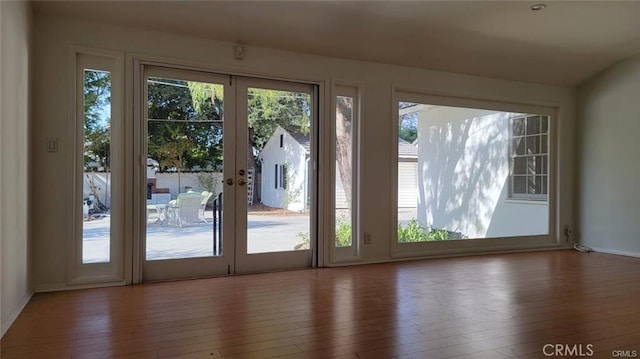 entryway featuring hardwood / wood-style flooring and french doors