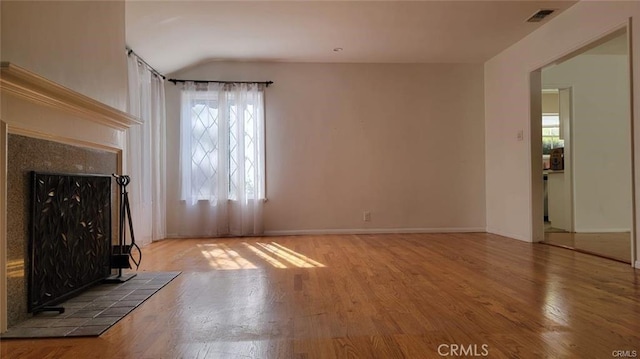 unfurnished living room featuring hardwood / wood-style flooring