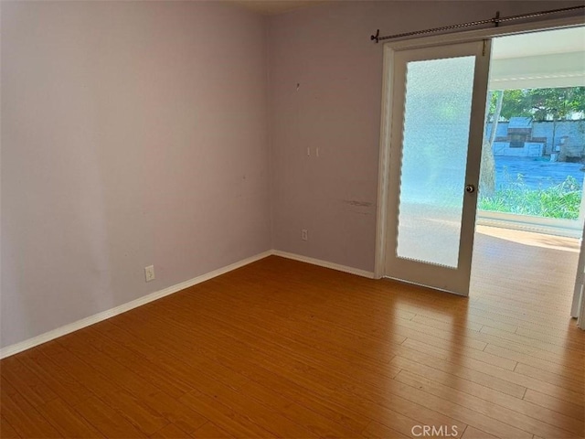 empty room with light hardwood / wood-style floors