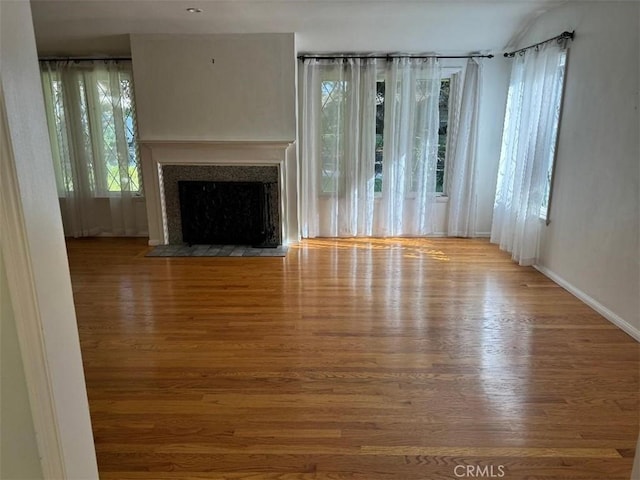 unfurnished living room featuring light wood-type flooring