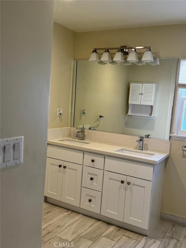 bathroom with hardwood / wood-style floors and vanity