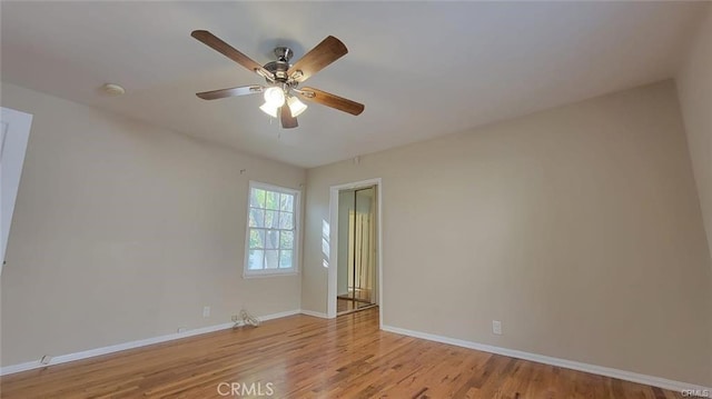 spare room featuring light hardwood / wood-style flooring and ceiling fan