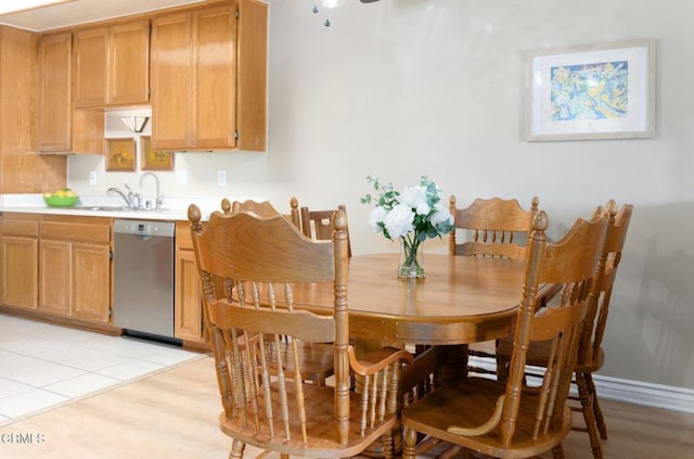 dining area featuring light hardwood / wood-style floors and sink