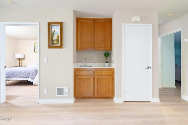 kitchen featuring light hardwood / wood-style floors and sink