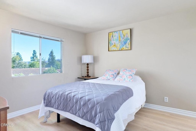 bedroom featuring light wood-type flooring