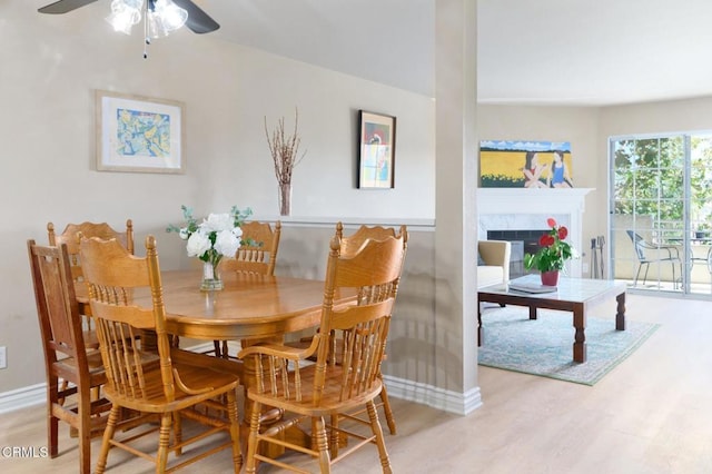 dining room featuring ceiling fan and light hardwood / wood-style floors