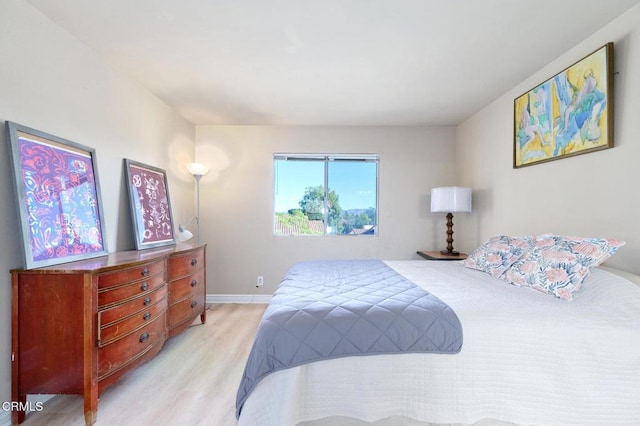 bedroom featuring light hardwood / wood-style floors