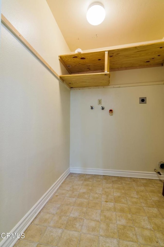 washroom with gas dryer hookup, light tile patterned floors, washer hookup, and hookup for an electric dryer