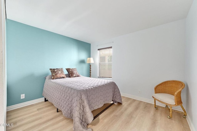 bedroom with light hardwood / wood-style flooring