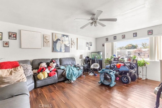 living room with hardwood / wood-style flooring and ceiling fan