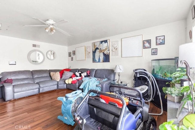 living room with ceiling fan and hardwood / wood-style flooring