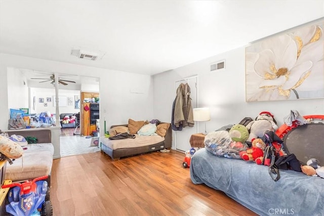 bedroom with hardwood / wood-style floors and ceiling fan