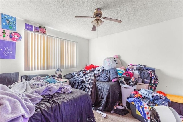 carpeted bedroom with a textured ceiling and ceiling fan