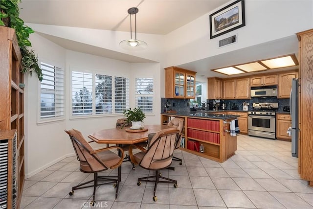 tiled dining area featuring plenty of natural light