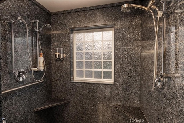 bathroom featuring a tile shower