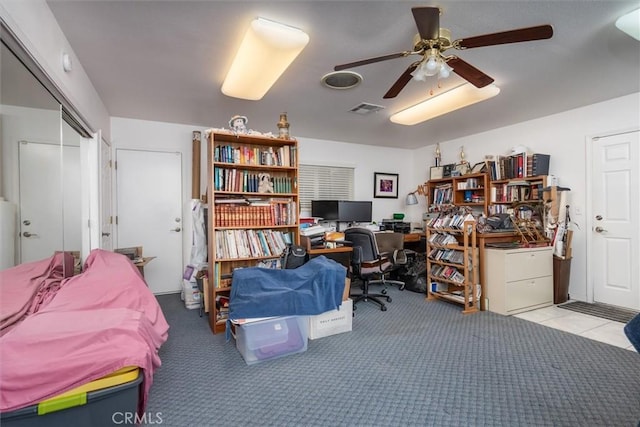 office with ceiling fan and light carpet