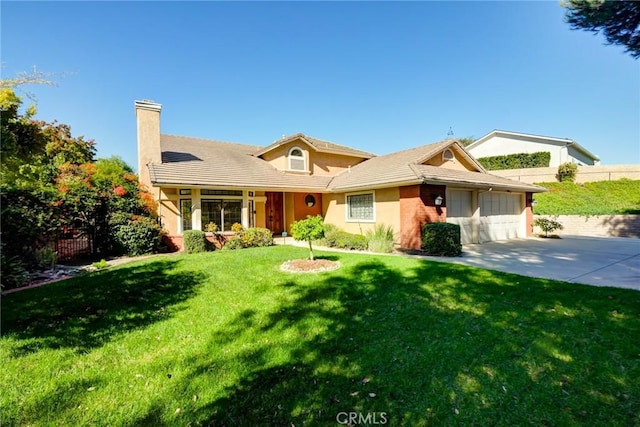 view of front facade with a front yard and a garage