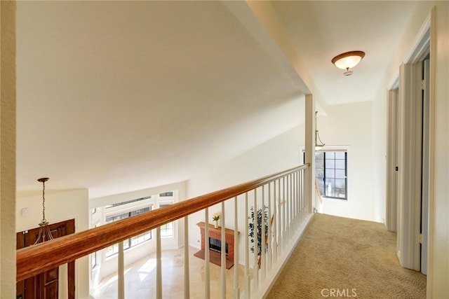 hall featuring light colored carpet