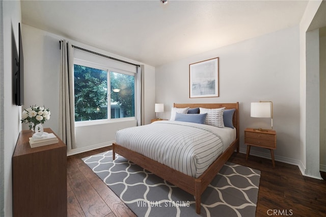 bedroom featuring dark hardwood / wood-style floors