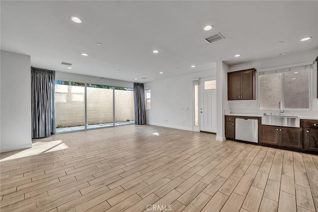 interior space featuring sink and light hardwood / wood-style floors