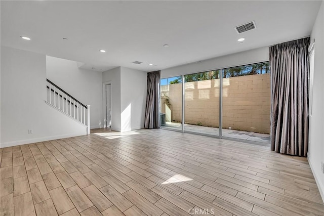 unfurnished living room featuring light wood-type flooring