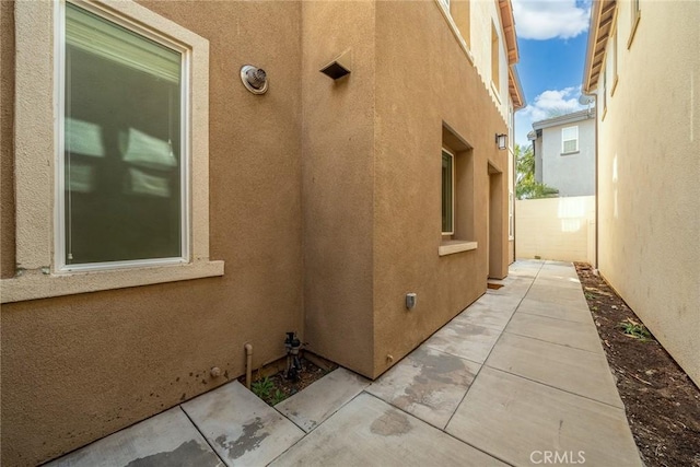 view of side of home featuring a patio