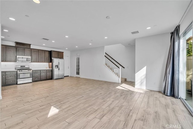 unfurnished living room featuring light hardwood / wood-style flooring