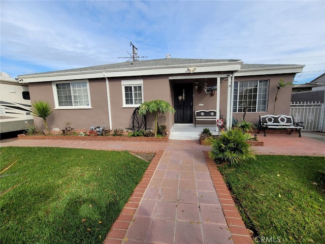 view of front of home with a front lawn