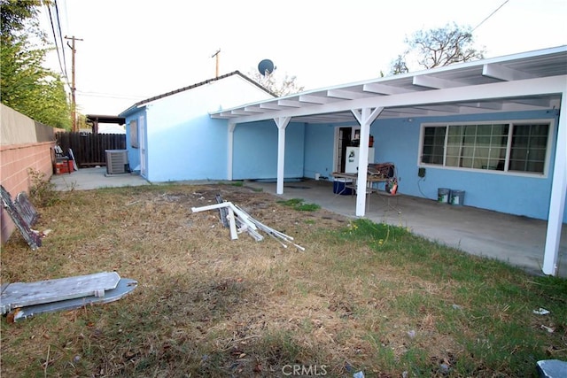 rear view of property featuring a patio and central AC unit