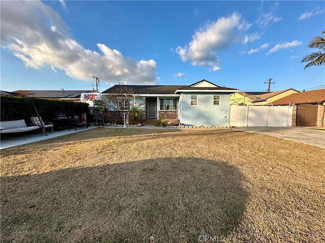 ranch-style house with a front lawn