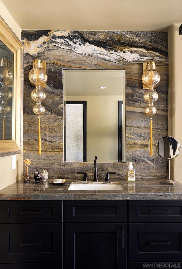 bathroom with decorative backsplash and vanity