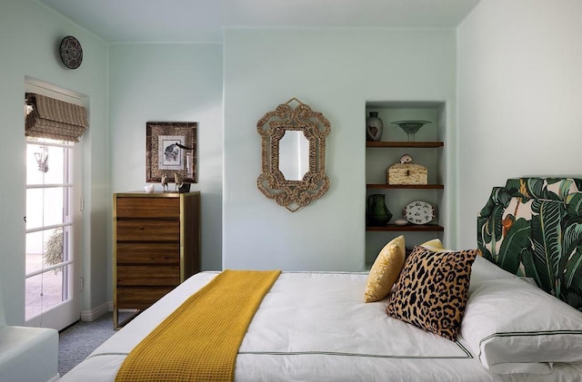 bedroom featuring carpet flooring and multiple windows