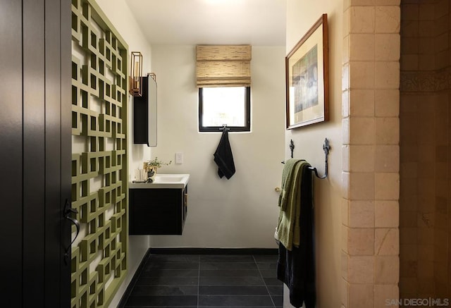 bathroom with tile patterned flooring and vanity