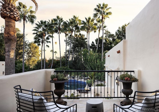 view of balcony at dusk