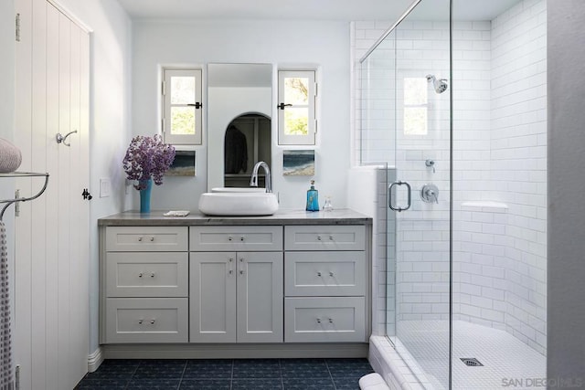 bathroom with vanity and walk in shower