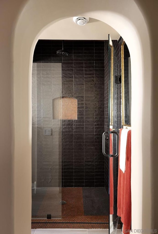 bathroom with a shower with shower door