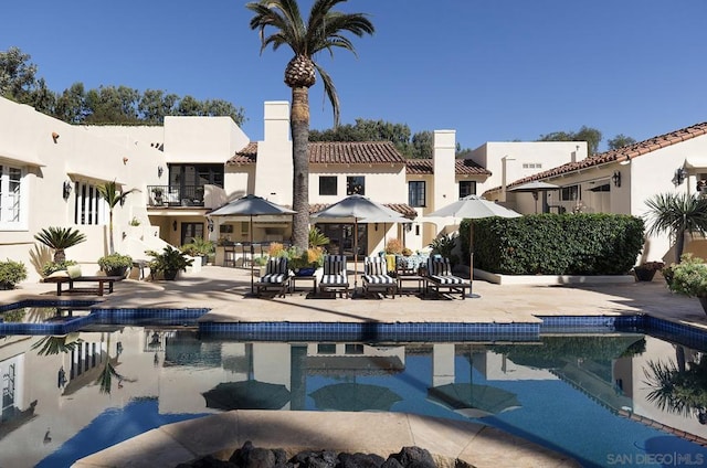 view of swimming pool featuring a patio area