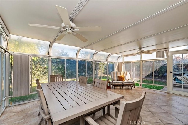 sunroom with ceiling fan and plenty of natural light