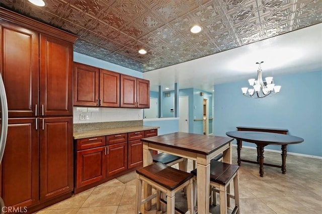 kitchen featuring a notable chandelier and decorative light fixtures